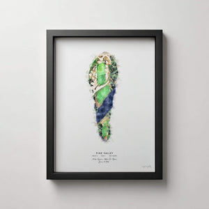 Framed golf course art print featuring a watercolor illustration of Pine Valley hole 5 layout in green, blue, and beige tones, displayed on a light gray wall.